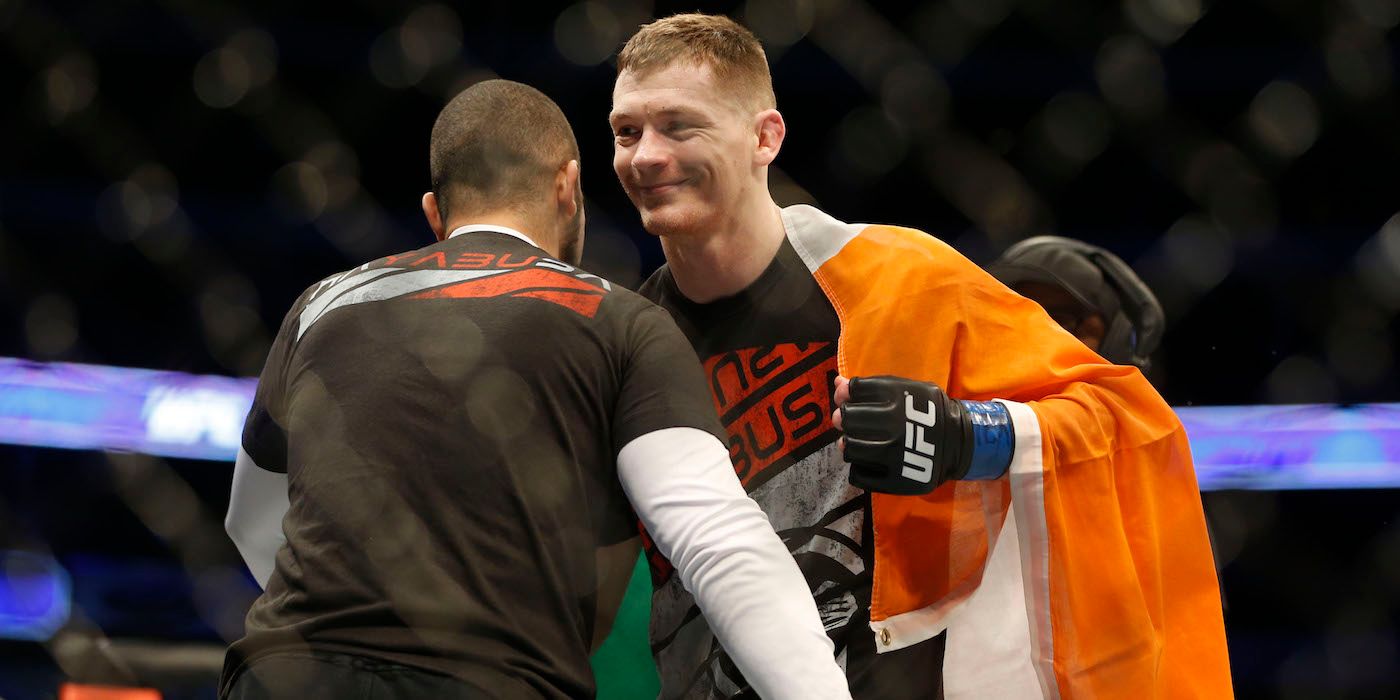 Joseph Duffy hugs his coach in the UFC octagon 