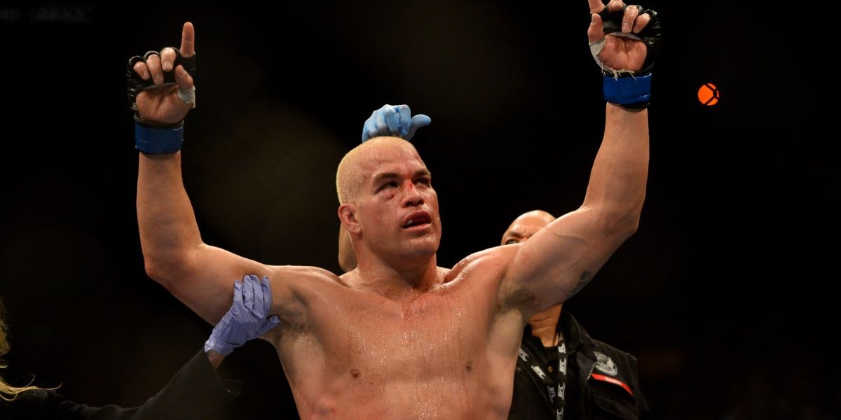 Tito Ortiz holds his hands up in the air