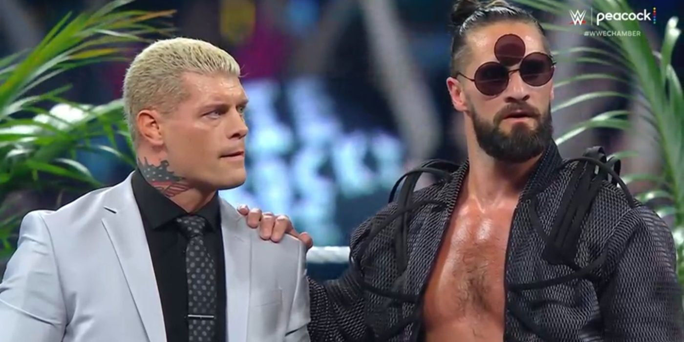seth rollins with his hand on cody rhodes' shoulder