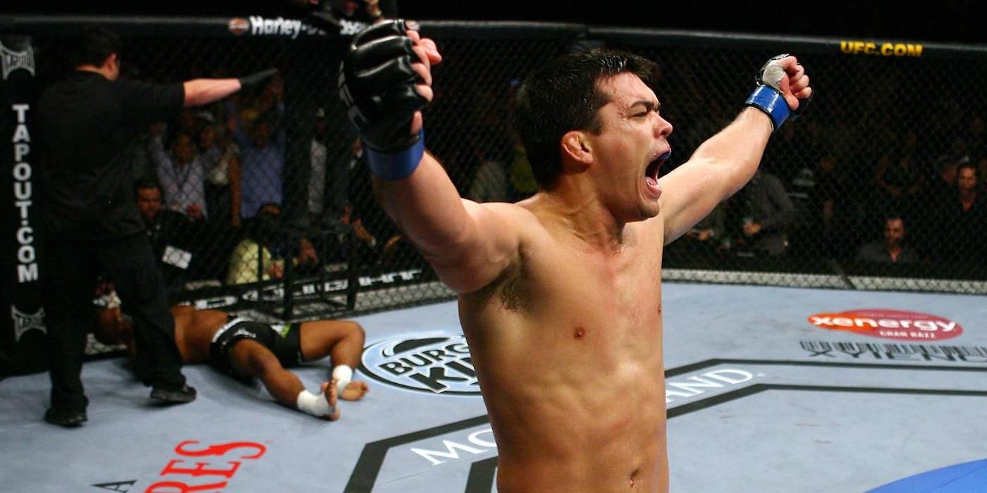 Lyoto Machida raises his hands after beating Rashad Evans