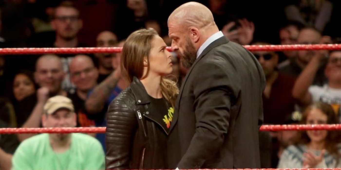 ronda rousey nose to nose with triple h