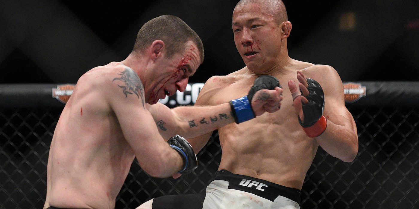 Kyoji Horiguchi throws a knee in the UFC octagon
