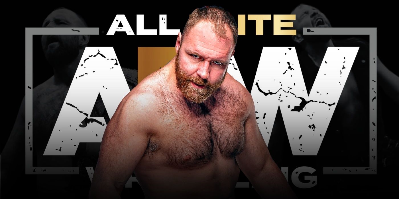 Jon Moxley in front of the AEW logo