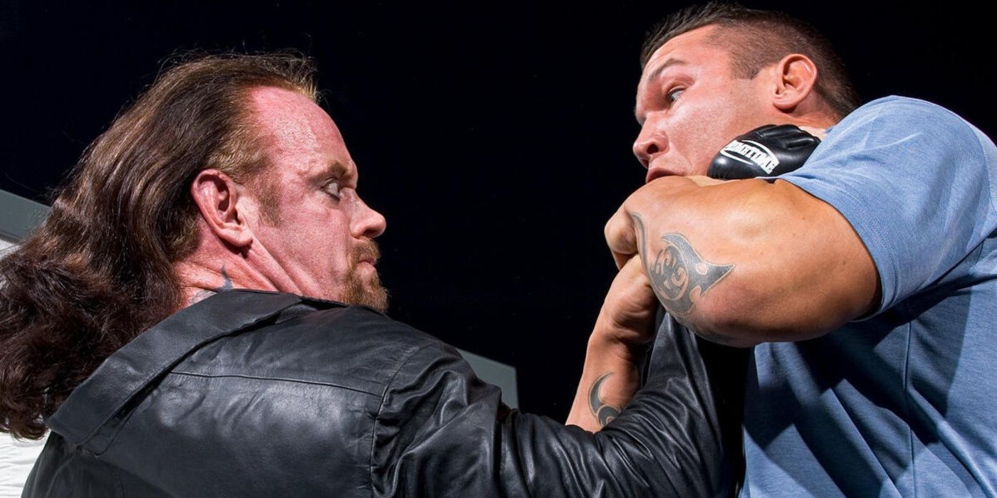 Undertaker chokes Randy Orton 