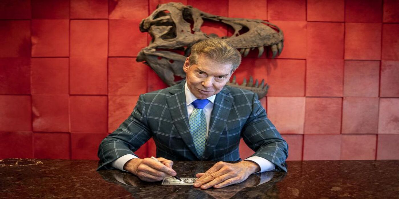 Vince McMahon signing a contract