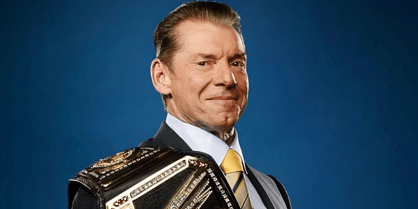 Vince Mcmahon with the WWE title