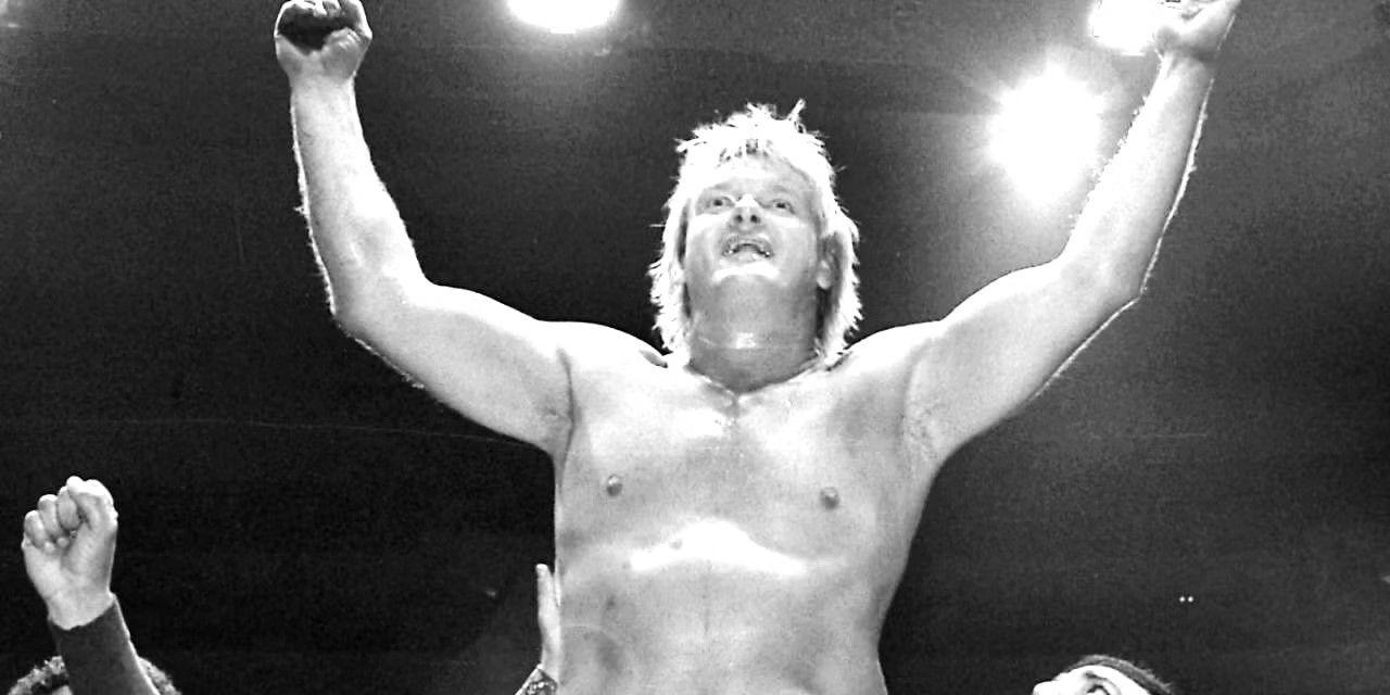 Johnny Valentine with his arms raised