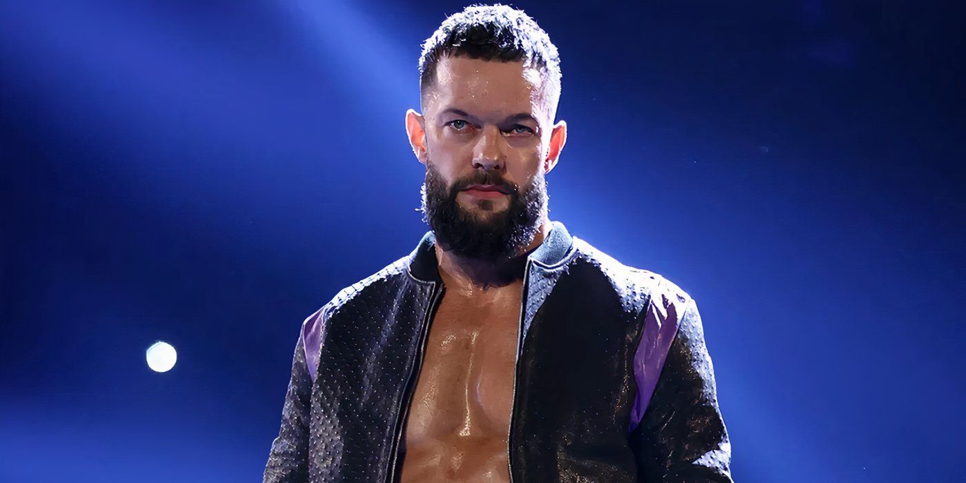 Finn Balor in WWE wearing a jacket and looking angry.