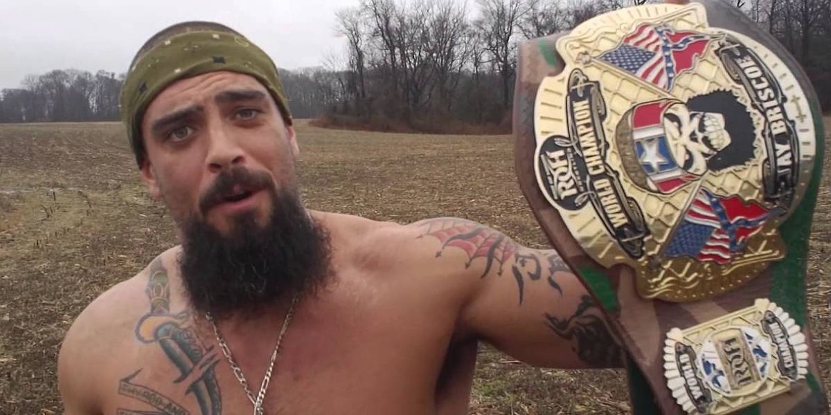 Mark Briscoe holding his custom ROH Championship.