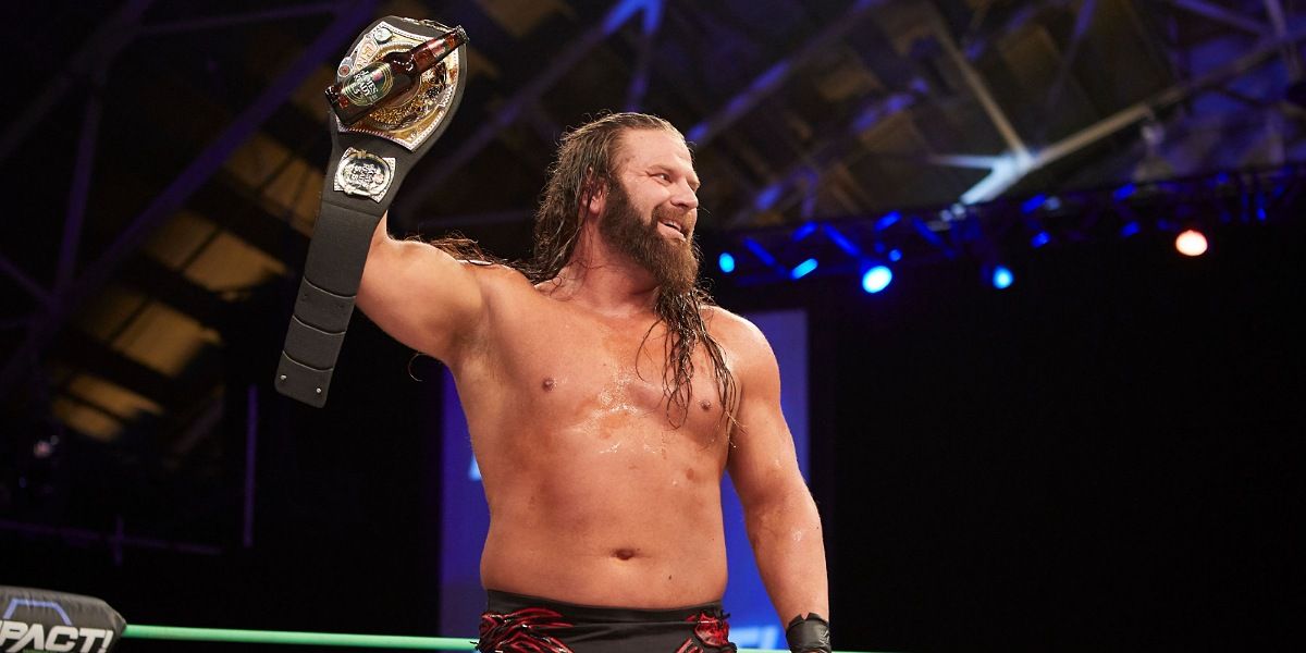 James Storm holding the TNA Beer Drinking Championship.