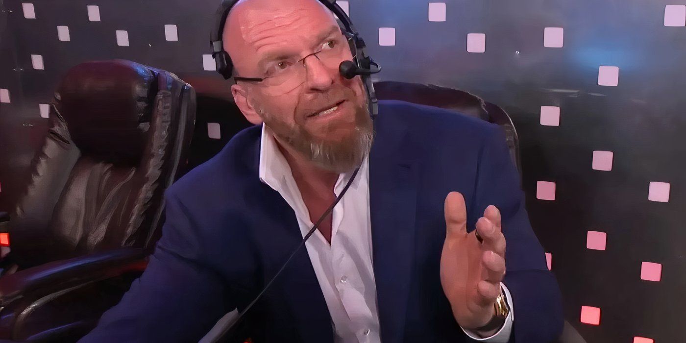 Triple H wearing a headset in the Gorilla position