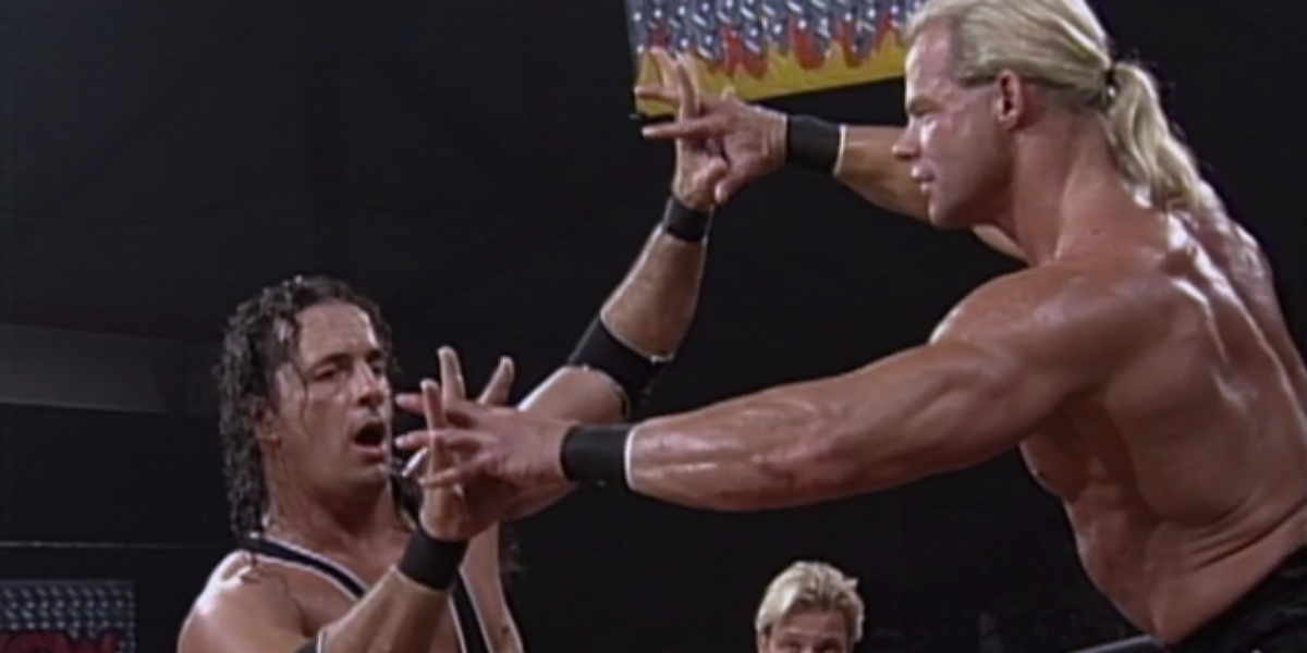 Bret Hart and Lex Luger locking up for a test of strength.