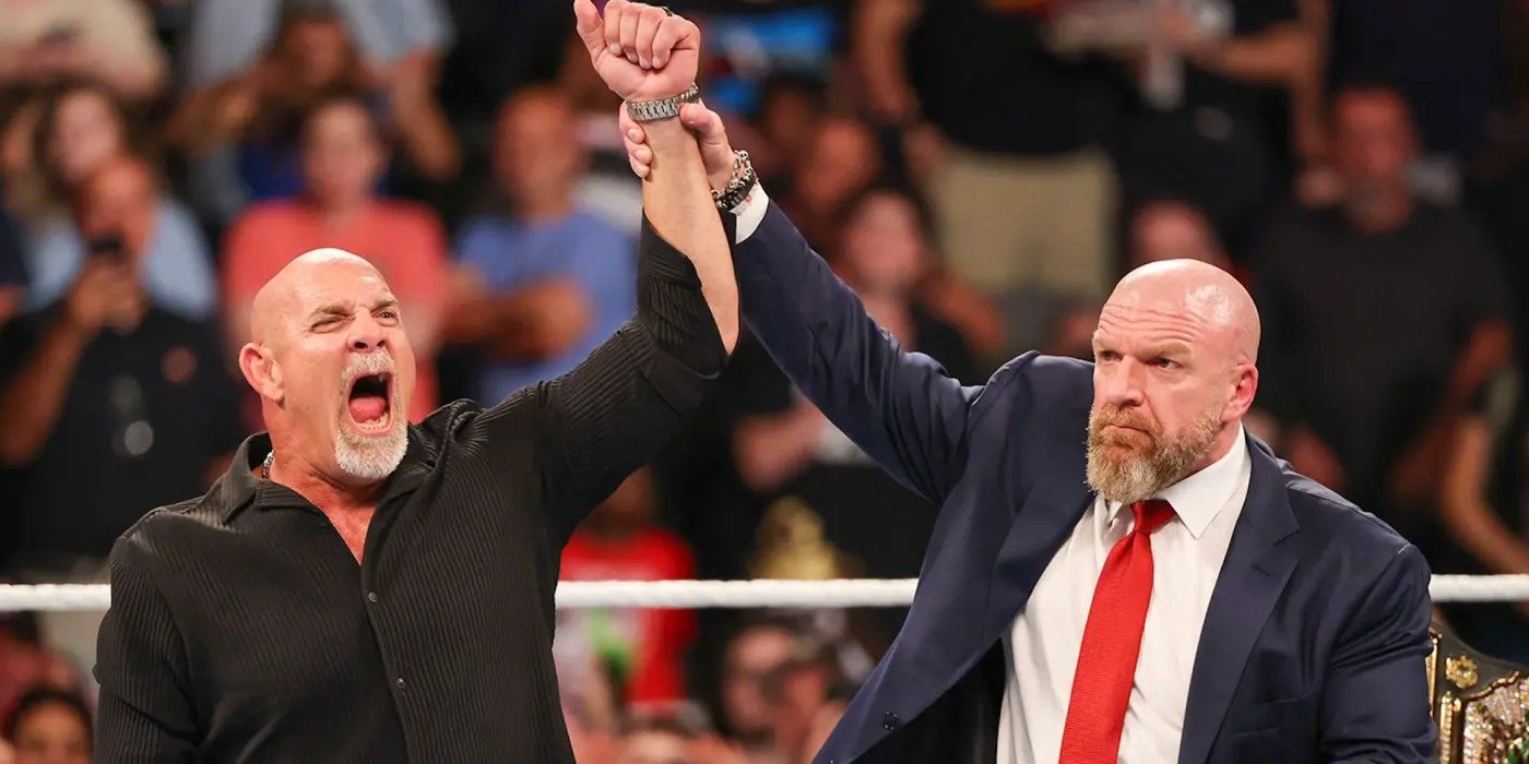 Triple H holds up Goldberg's arm at WWE Bad Blood