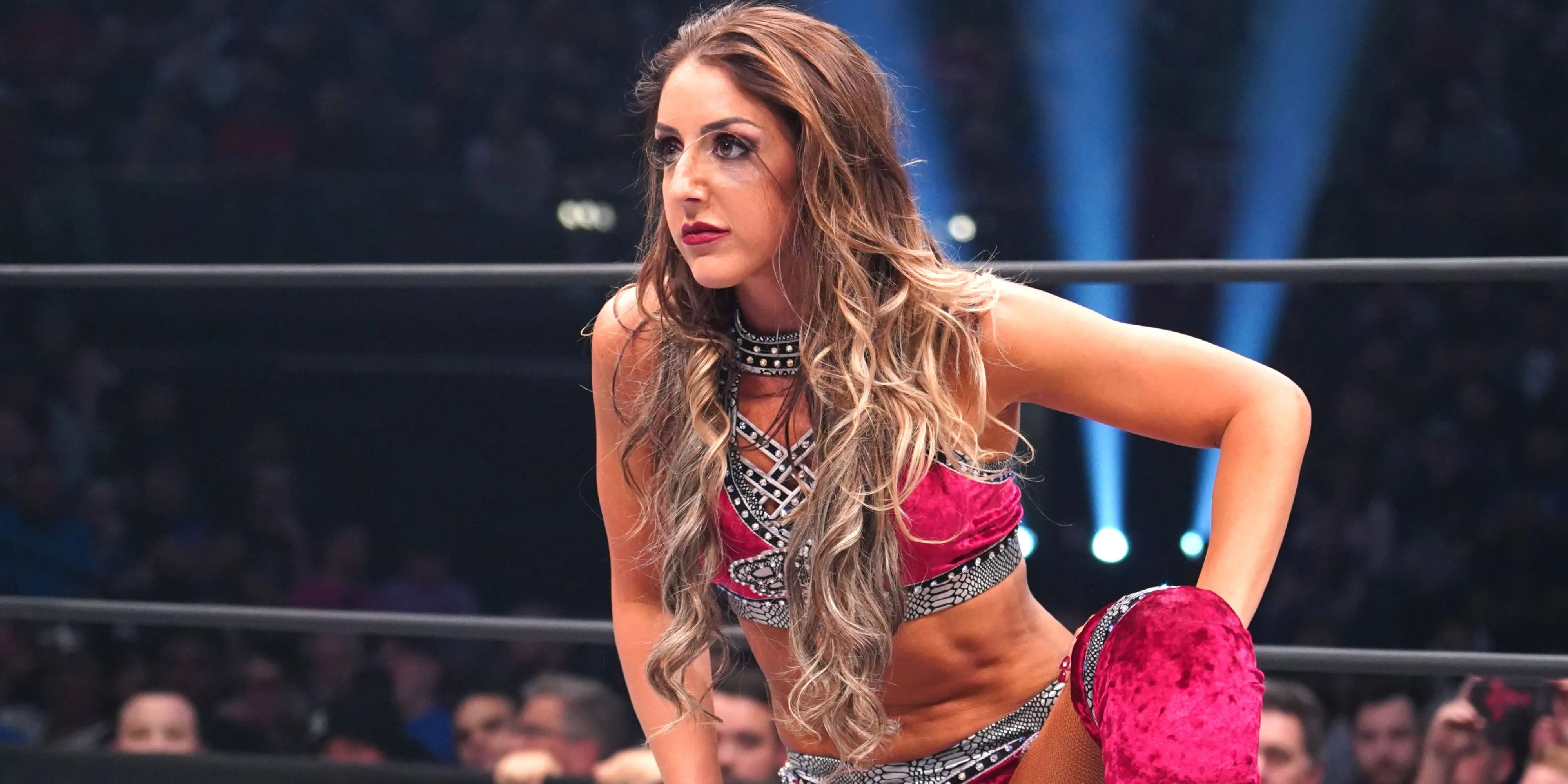 britt baker on one knee in the ring.