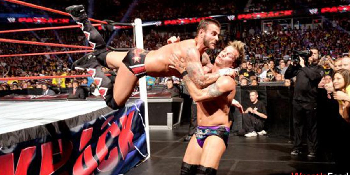 cm-punk-suicide-dive-on-chris-jericho-wwe-payback-2013.jpg