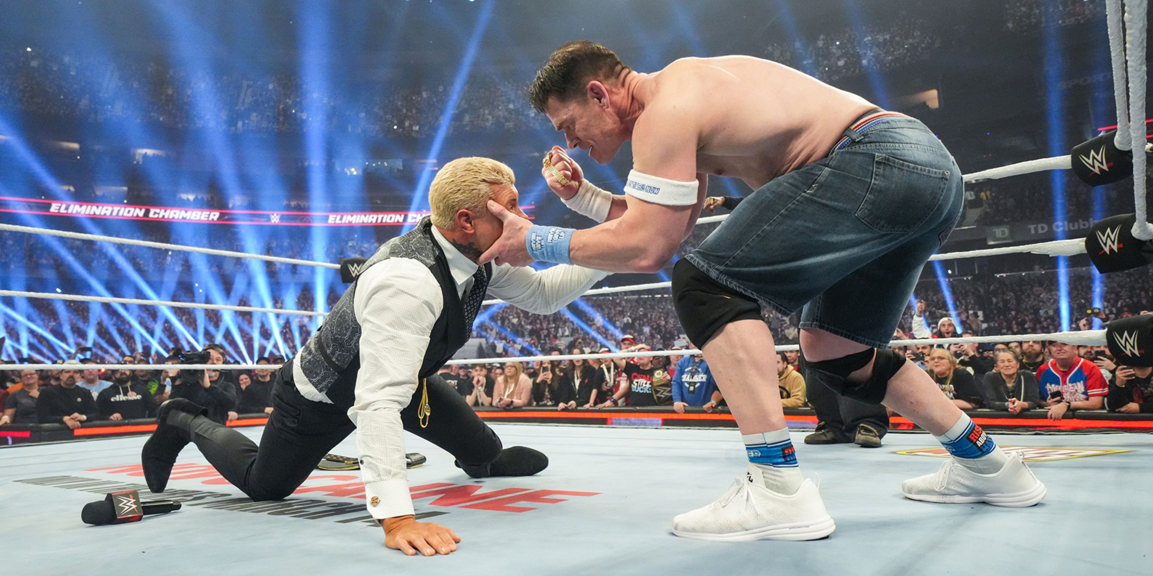 john cena holding his fist up to cody rhodes.