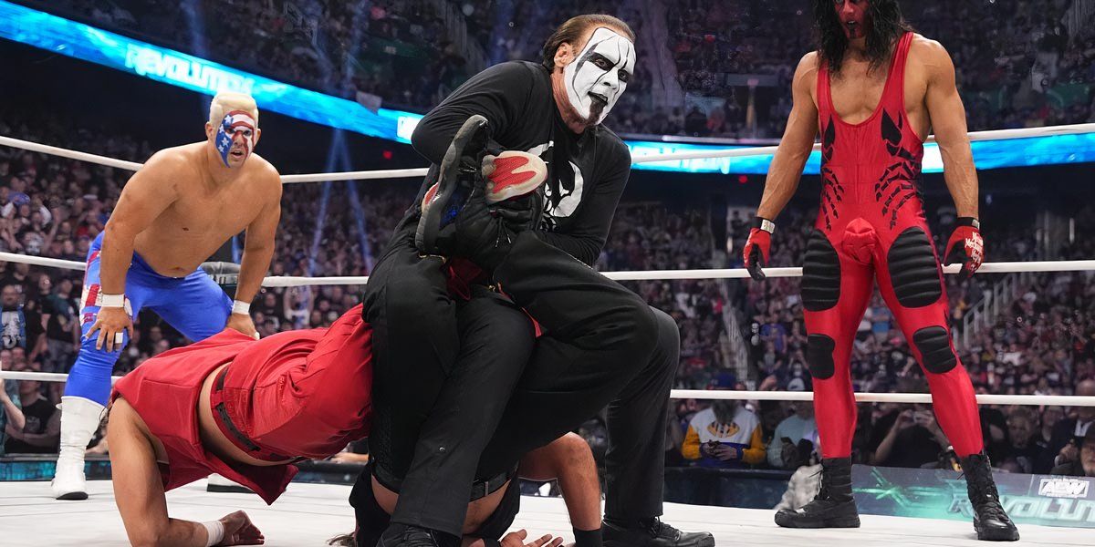Sting applies a Double Scorpion Deathlock on The Young Bucks at AEW Revolution 2024