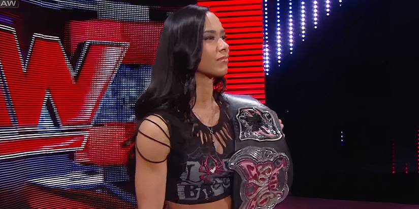 AJ Lee stands on-stage as WWE Divas Champion on WWE RAW in August 2013