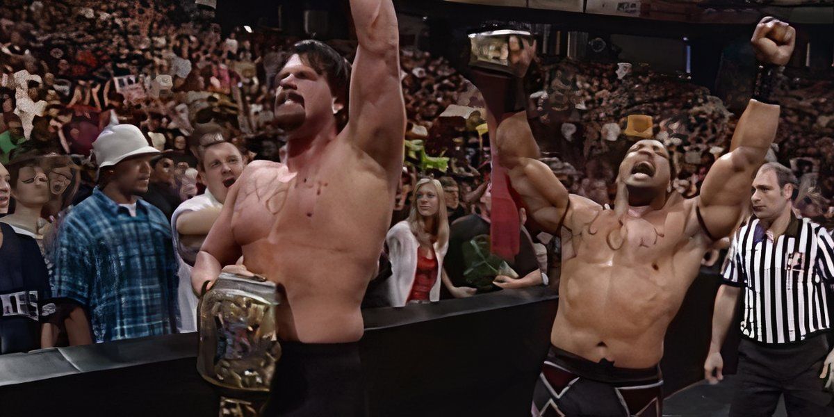 Acolite celebrates WWF Tag Team Champion at WWF Raw in May 1999