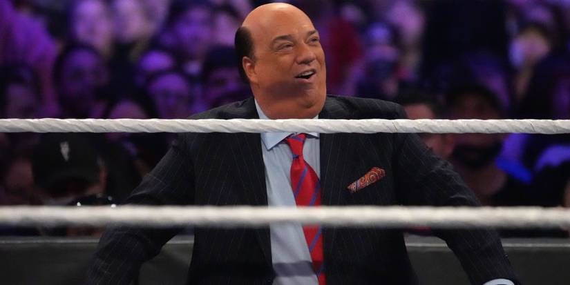 Paul Heyman smiling outside of a WWE ring