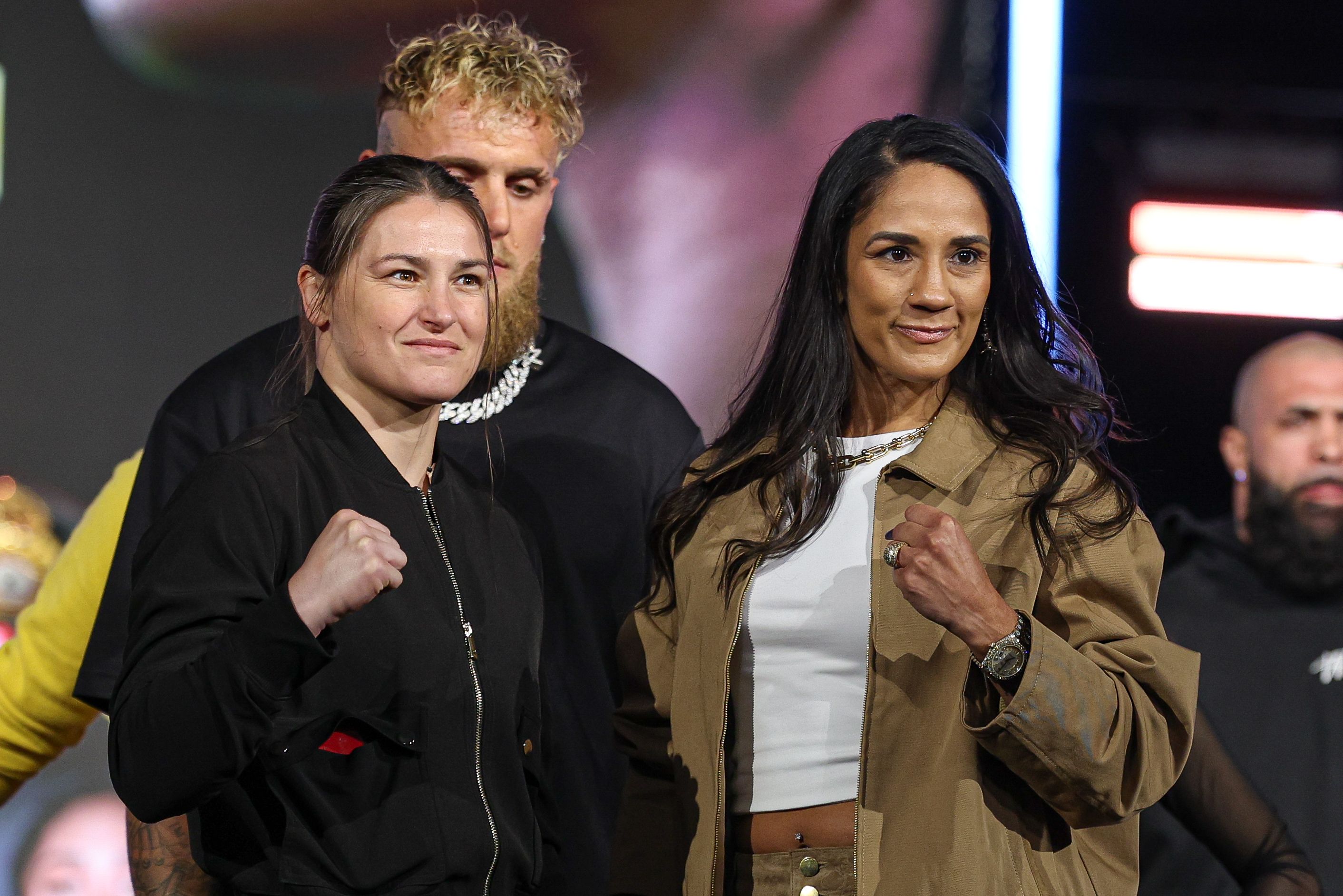 https://static0.thesportsterimages.com/wordpress/wp-content/uploads/2025/07/katie-taylor-amanda-serrano-3-conference.jpg