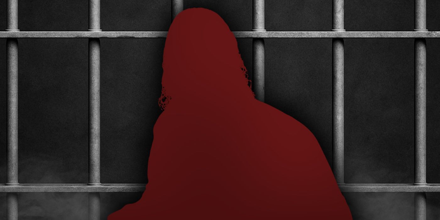 A silhouette of Buck Zumhofe in front of prison cell bars