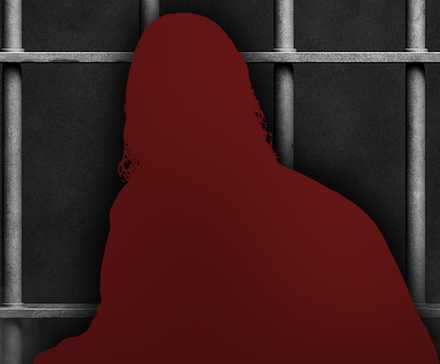 A silhouette of Buck Zumhofe in front of prison cell bars