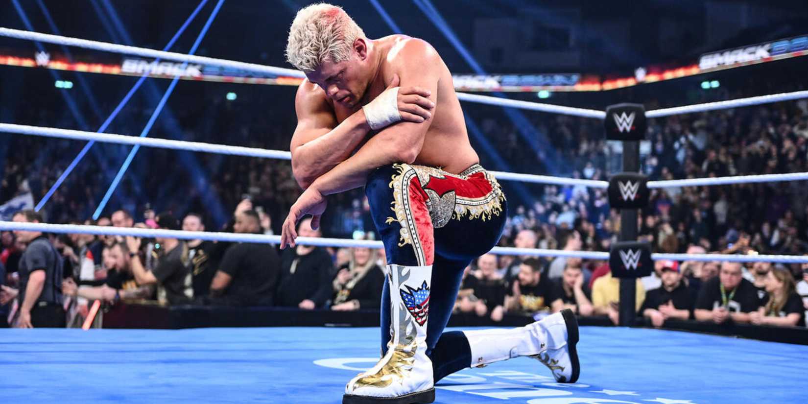 Triple H Has the Roles of Drew McIntyre and Cody Rhodes All Wrong 2 cody rhodes on one knee in the middle of the ring.