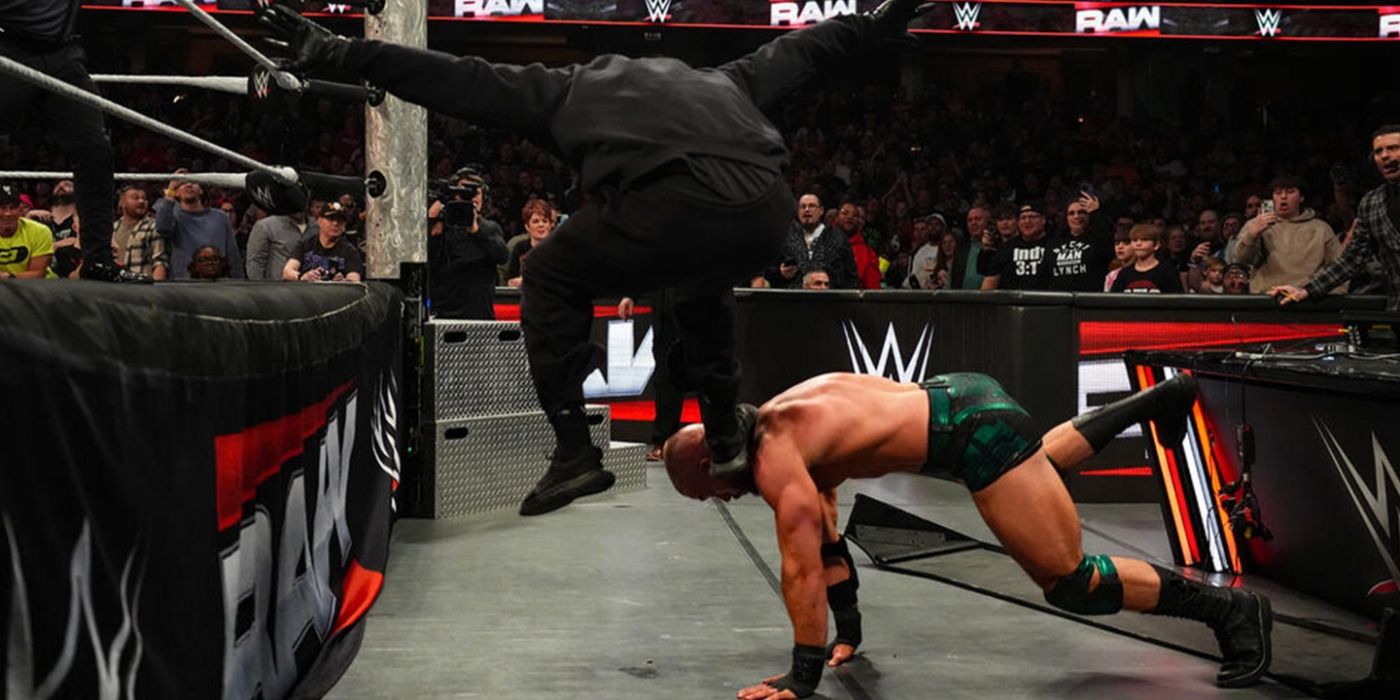 Masked Man stomping Austin Theory 