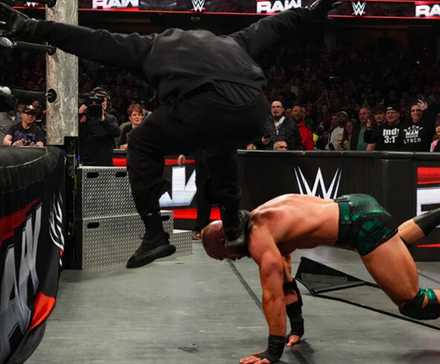 We've Figured Out the Identity of WWE's Mysterious Masked Man 1 Masked Man stomping Austin Theory