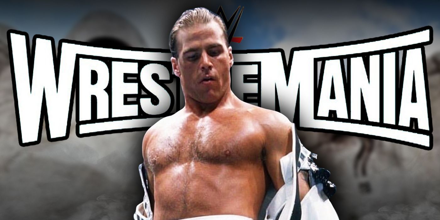 Shawn Michaels in front of the WWE WrestleMania logo