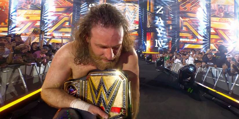 Sami Zayn celebrating as WWE Champion