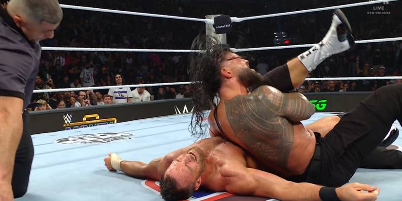 Roman Reigns pinning LA Knight 